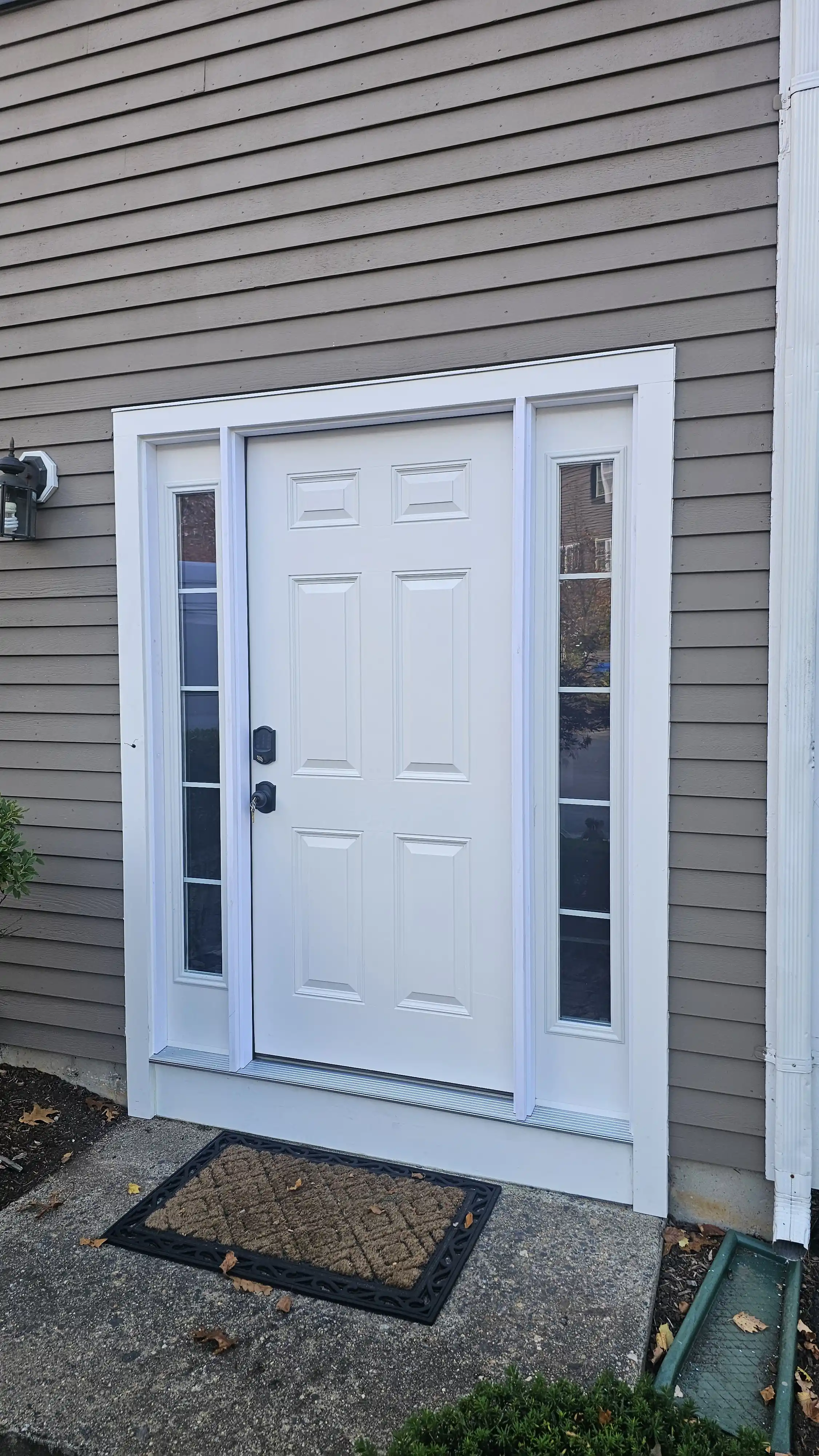 White six-panel door with decorative glass sidelites