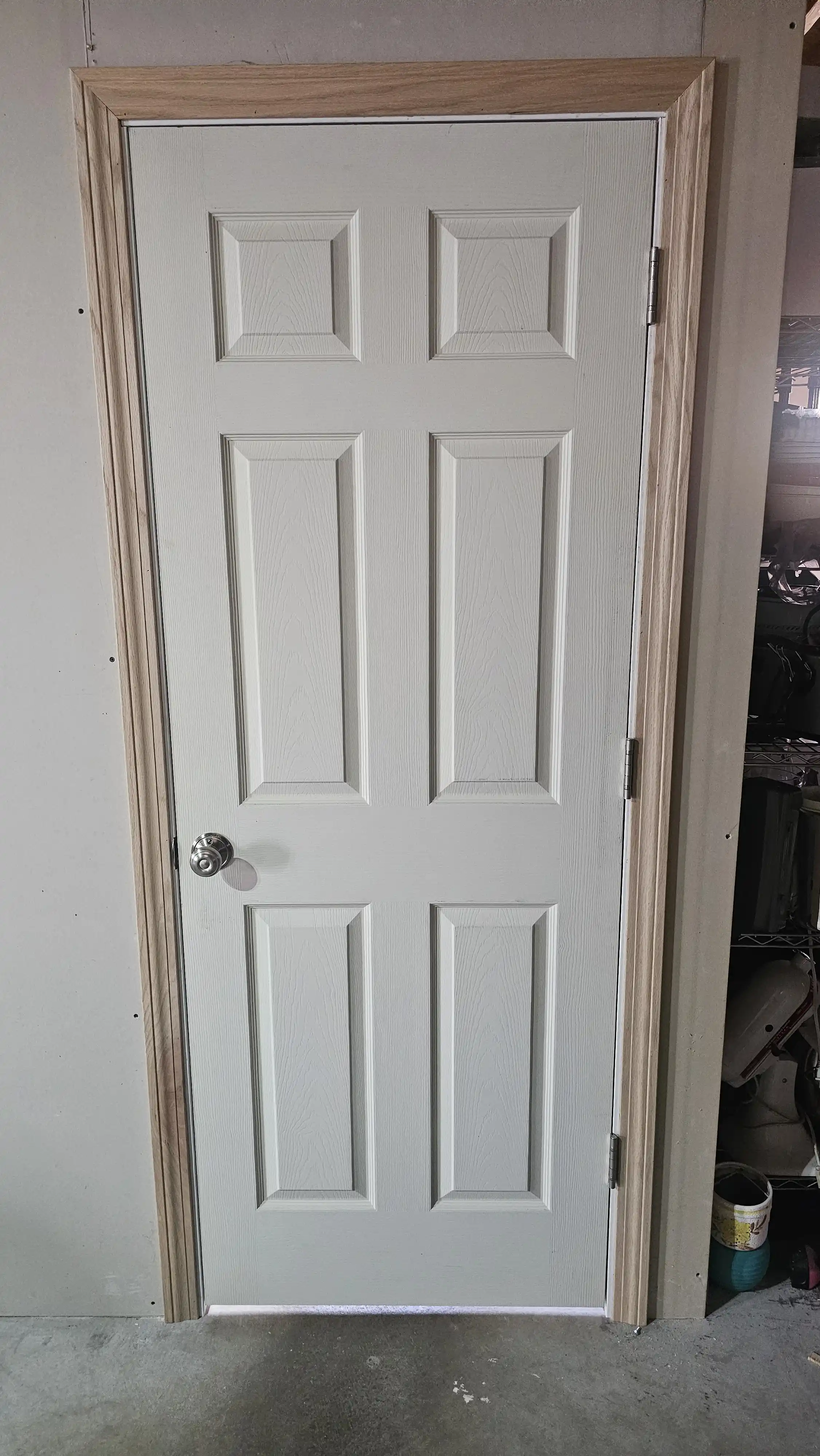 White interior door with a glass panel divided into 12 small sections